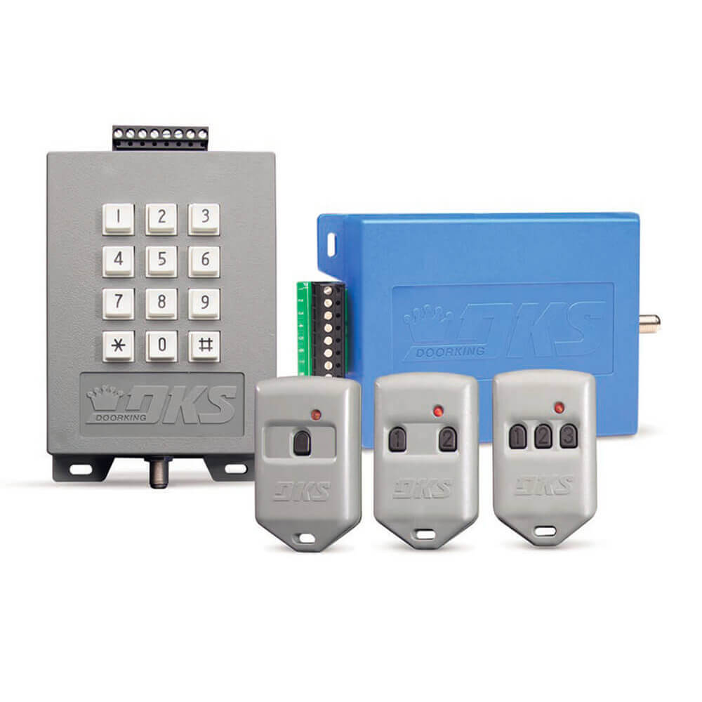 gray key pad and three gray plastic key fob transmitters and blue box